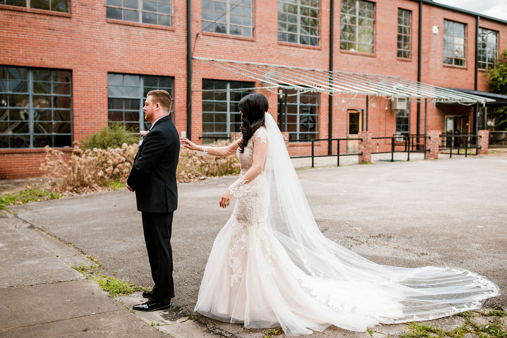 Wedding first look: Wedding at The Mill captured by John Myers Photography featured on Nashville Bride Guide