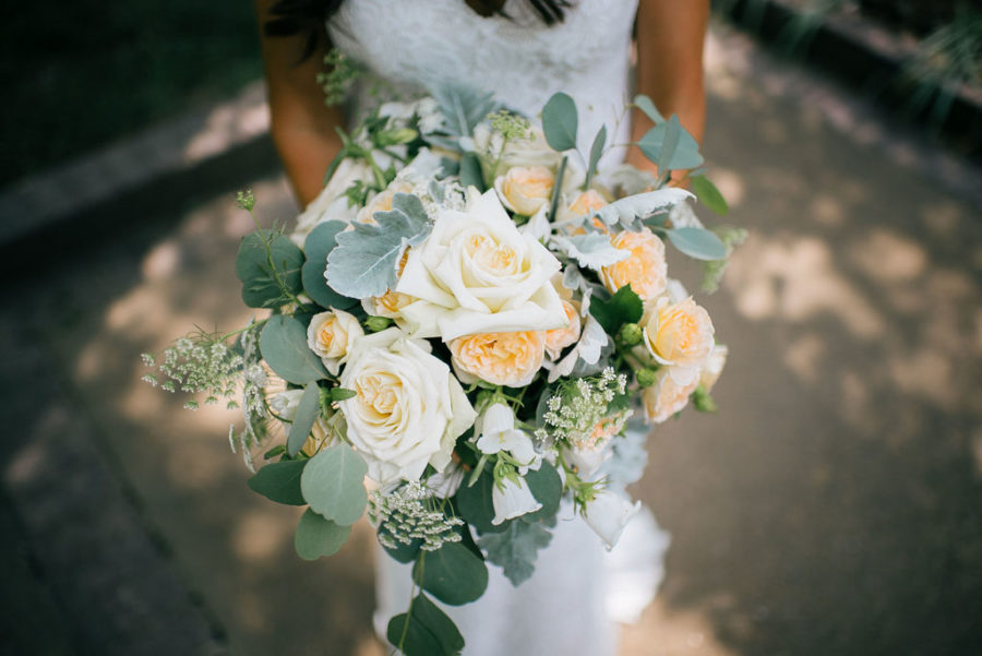 Orange and white wedding bouquet by FLWR Shop Nashville