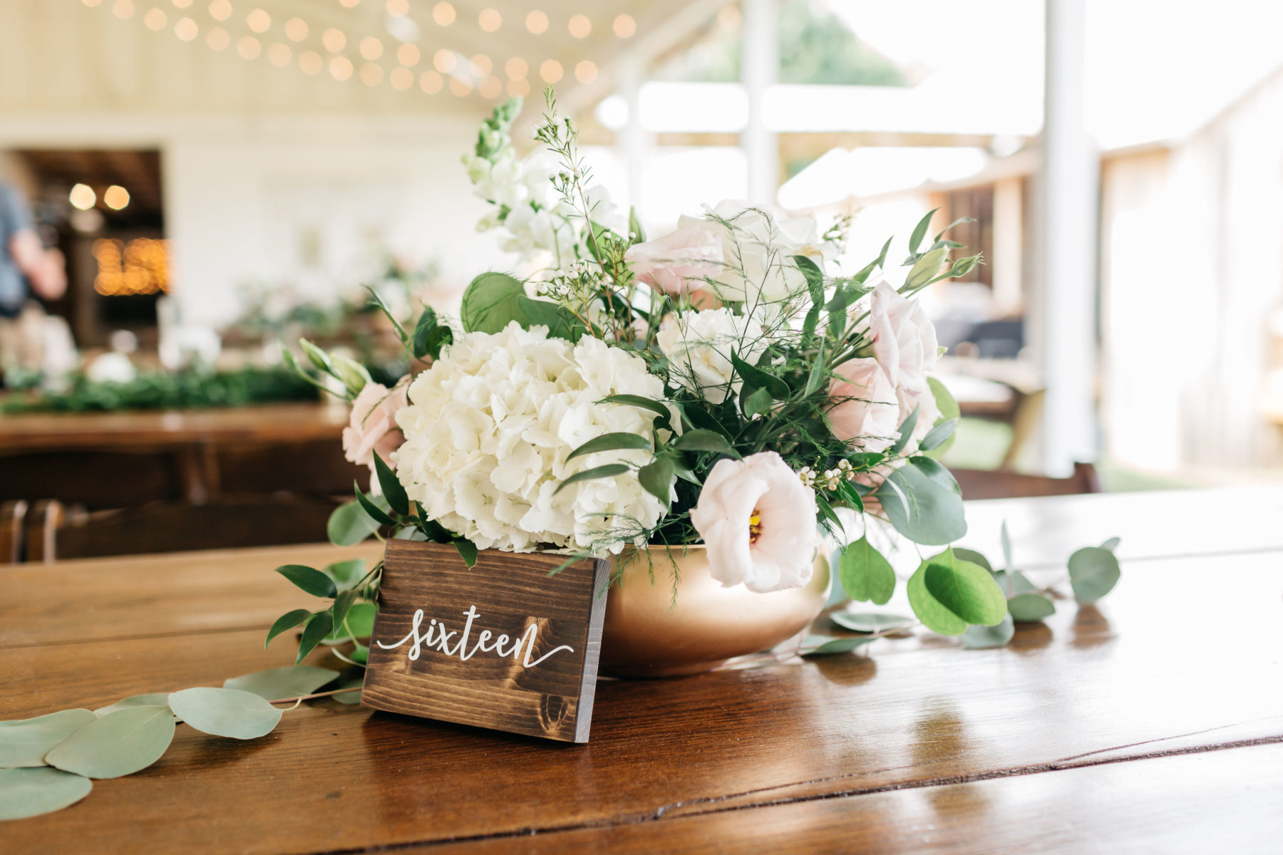 Wooden wedding table numbers: Rustic Front Porch Farms wedding featured on Nashville Bride Guide