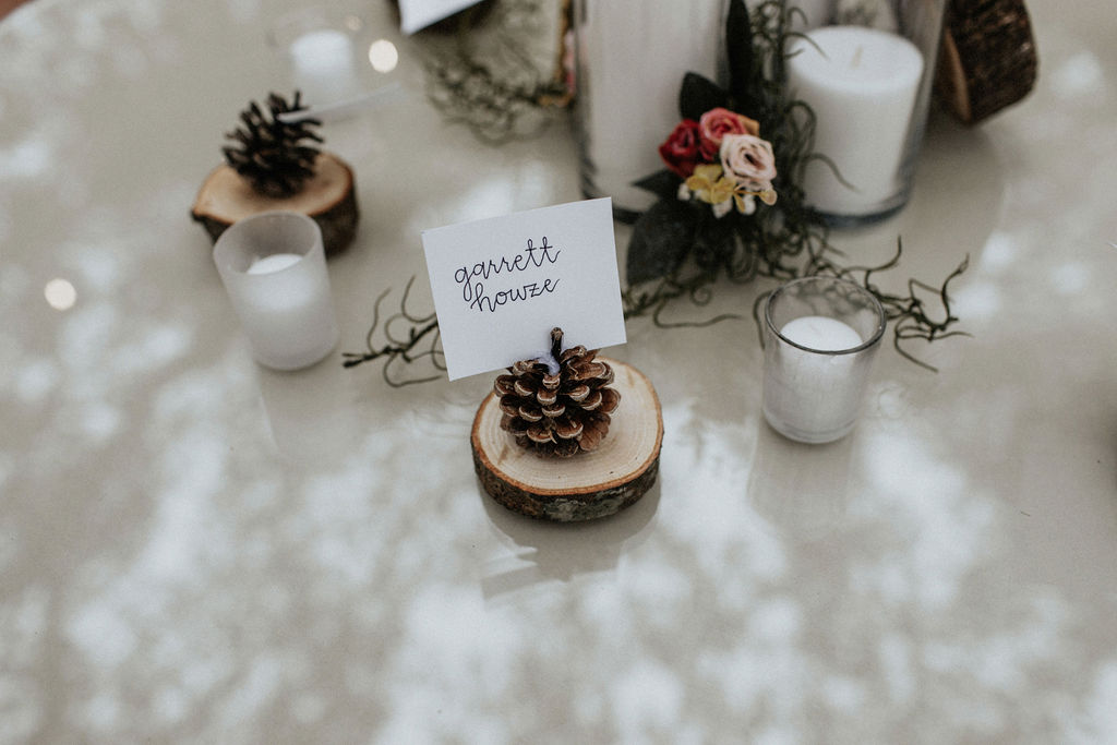 Pine cone wedding escort cards: Magical Winter Wedding by Meghan Melia Photography featured on Nashville Bride Guide!