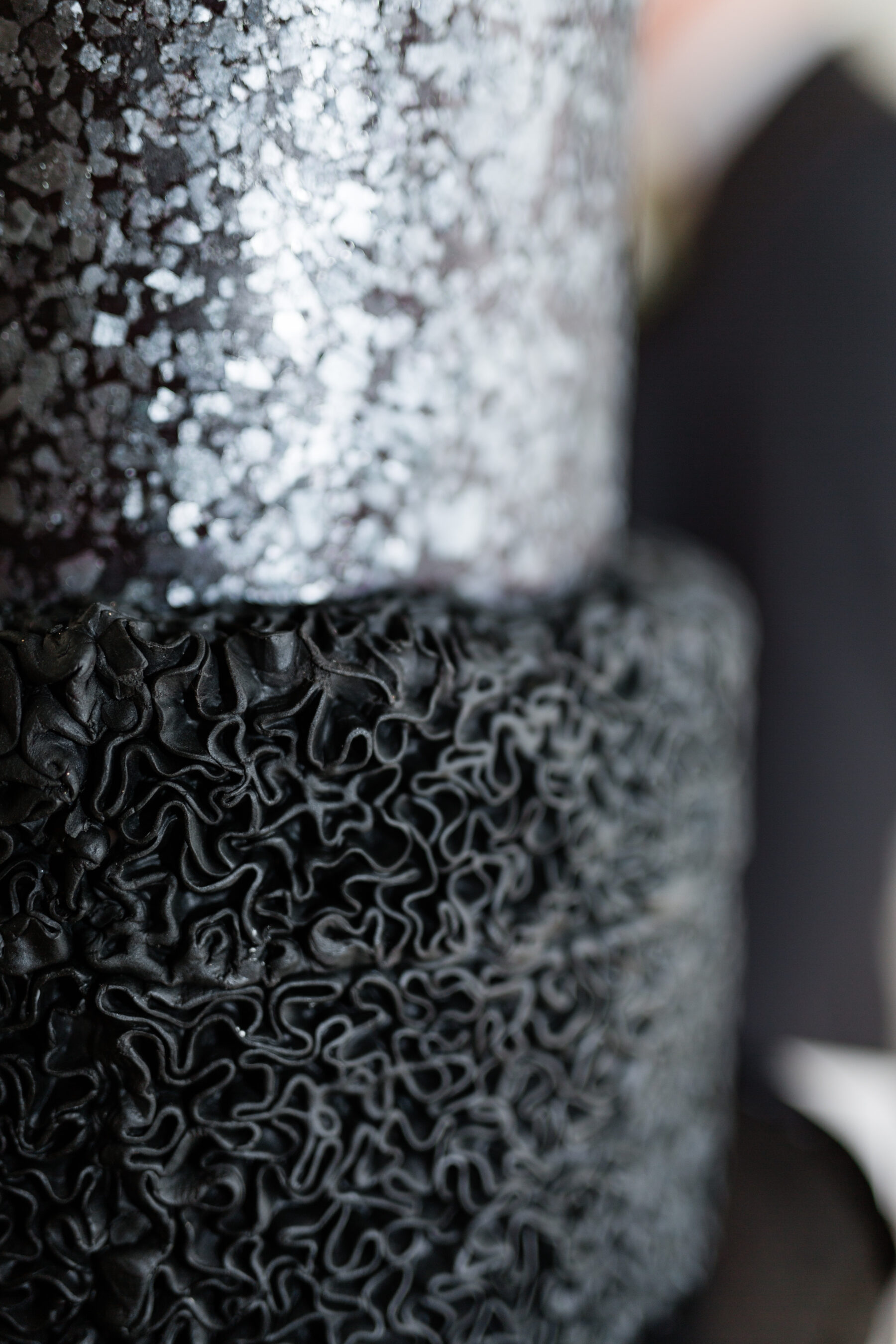 Modern textured black wedding cake: Classic, Yet Modern New Years Eve Wedding Inspiration featured on Nashville Bride Guide
