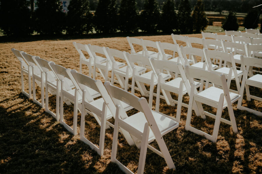 Outdoor wedding ceremony seating: Boho Barn Wedding by Melissa Marie Floral Designs