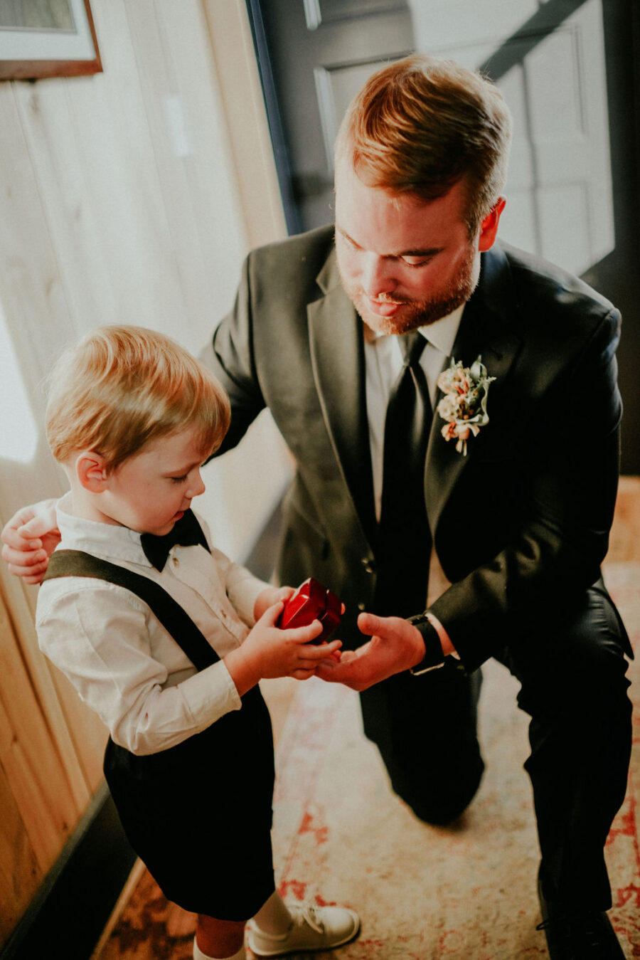Groom with ring bearer: Boho Barn Wedding by Melissa Marie Floral Designs