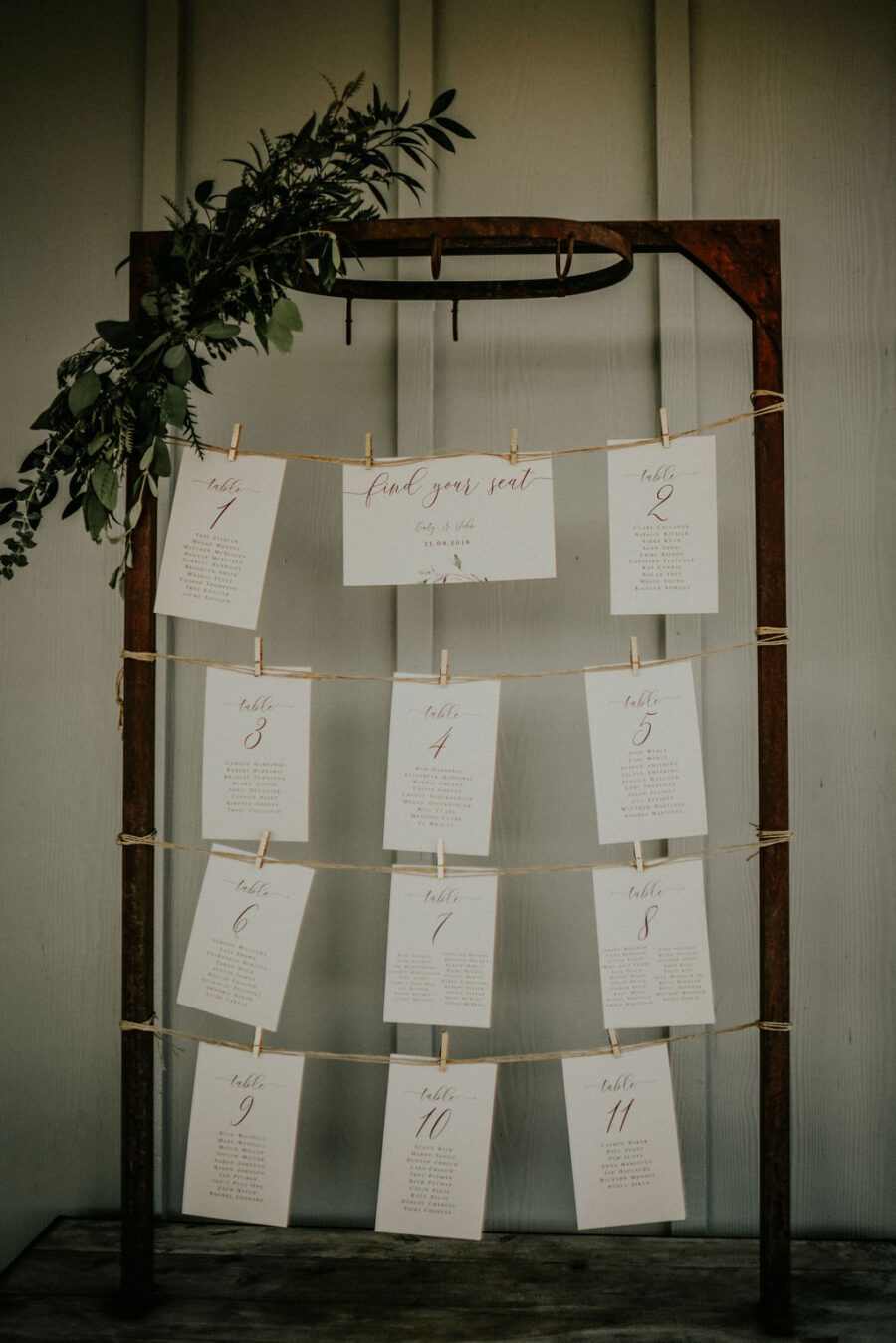 Wedding escort card display: Boho Barn Wedding by Melissa Marie Floral Designs