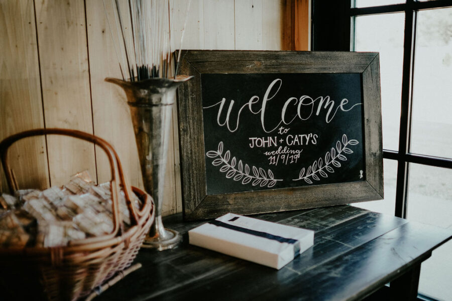 Chalkboard wedding welcome sign: Boho Barn Wedding by Melissa Marie Floral Designs