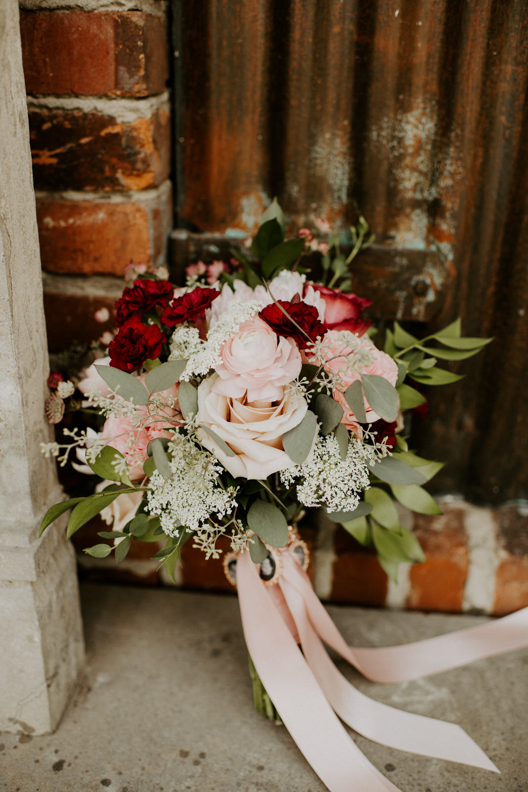 Blush pink and red wedding bouquet: Romantic Nashville Wedding at The Bedford featured on Nashville Bride Guide