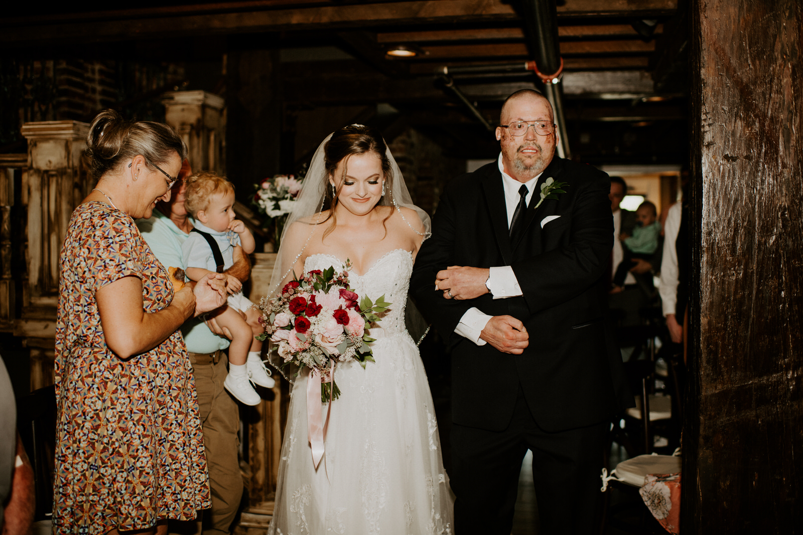 Bride walking down the aisle with father: Romantic Nashville Wedding at The Bedford featured on Nashville Bride Guide