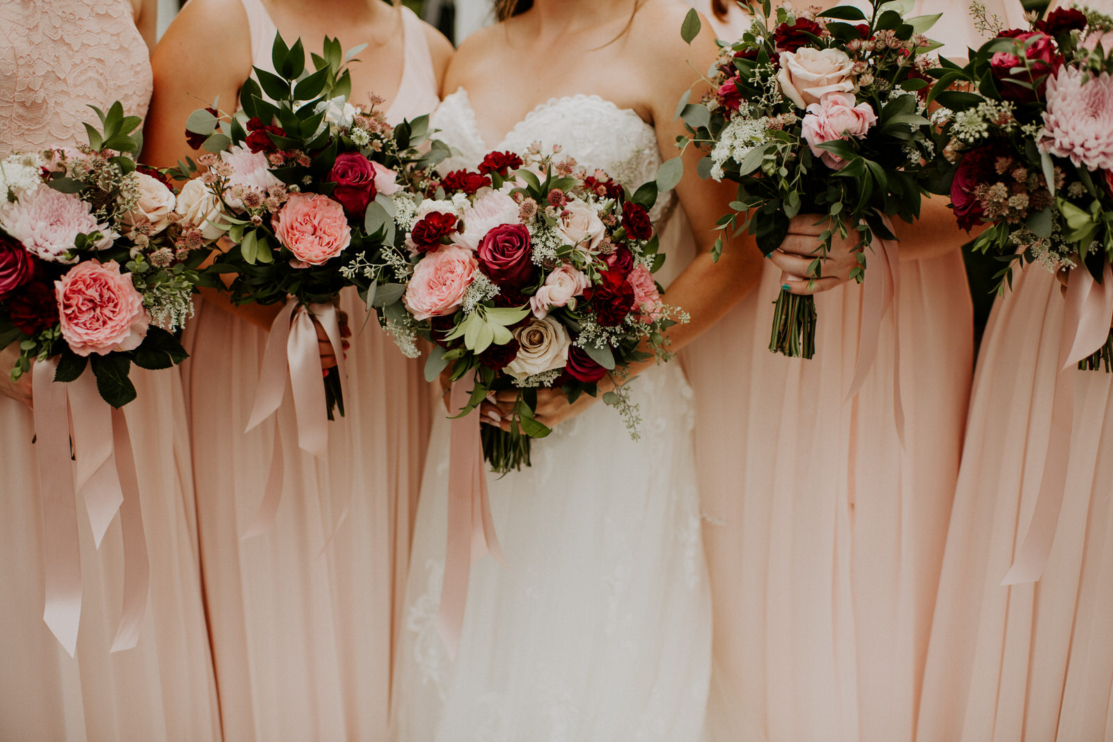 Pink and red wedding bouquets: Romantic Nashville Wedding at The Bedford featured on Nashville Bride Guide