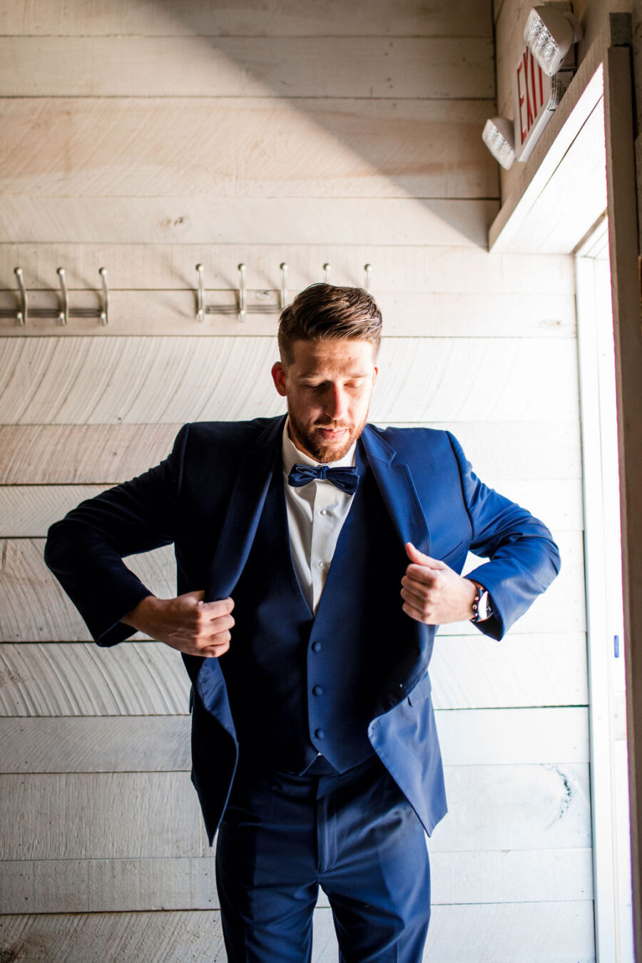 Navy blue groomsmen tuxedo: Intimate Barn Wedding from John Myers Photography