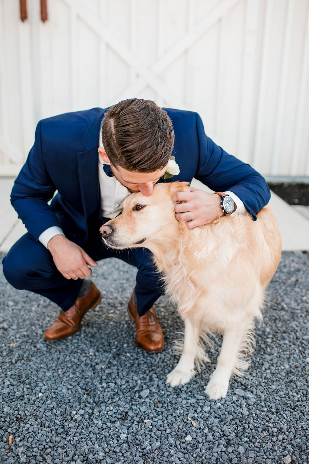 Groom with dog portrait: Intimate Barn Wedding from John Myers Photography