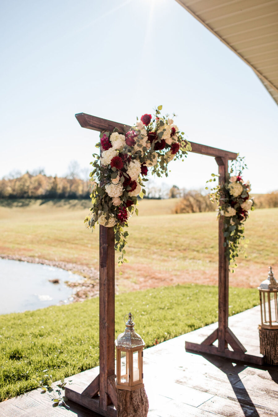 Outdoor wedding ceremony backdrop: Intimate Barn Wedding from John Myers Photography