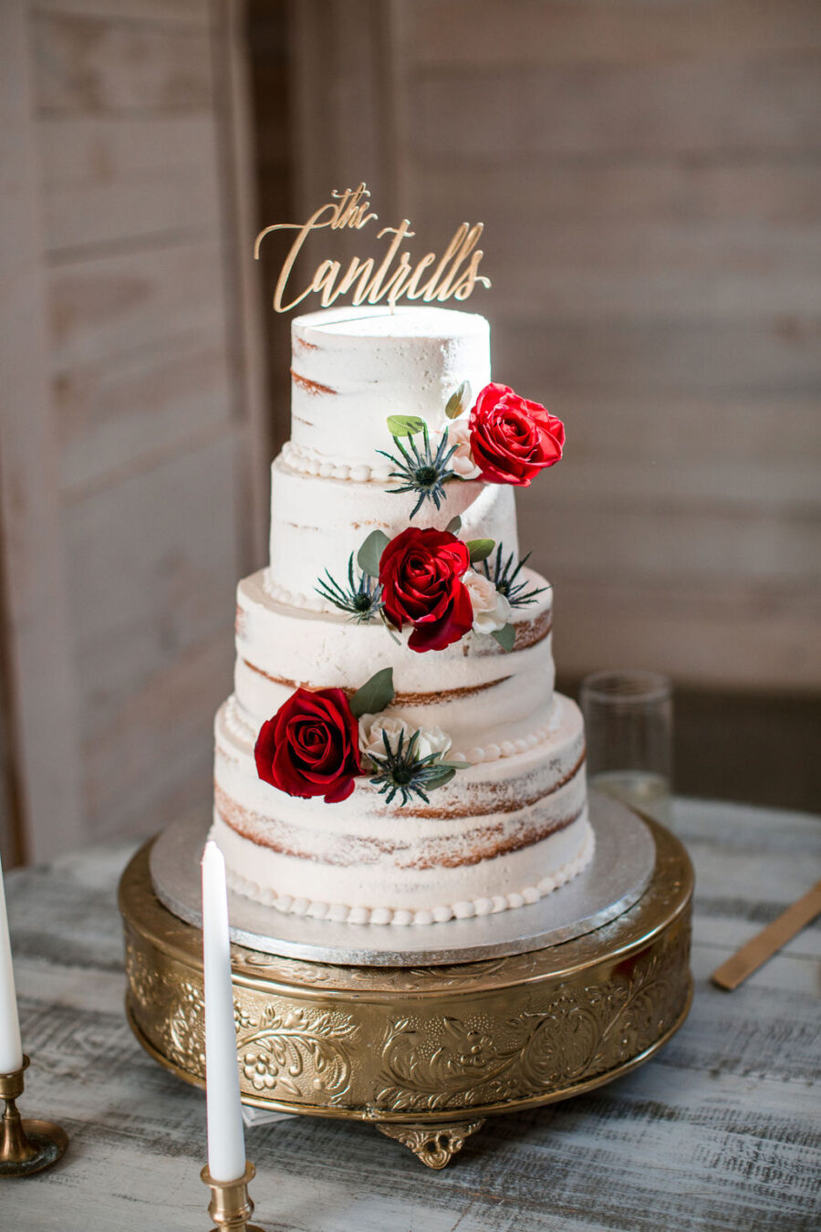 Semi naked red floral wedding cake: Intimate Barn Wedding from John Myers Photography