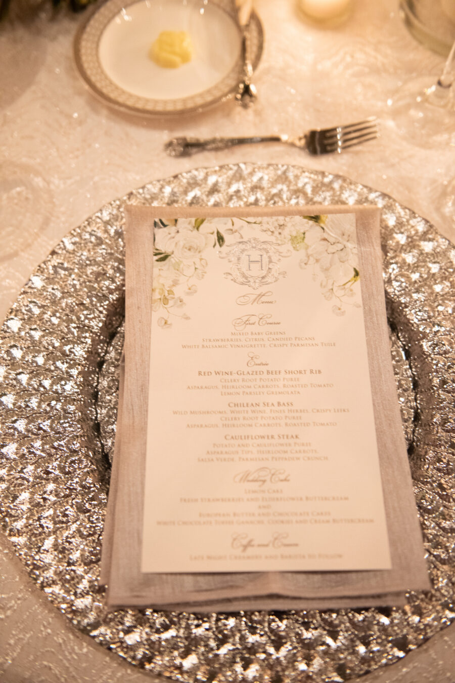Silver wedding charger: Floral Filled Luxurious Wedding by LMA Designs featured on Nashville Bride Guide