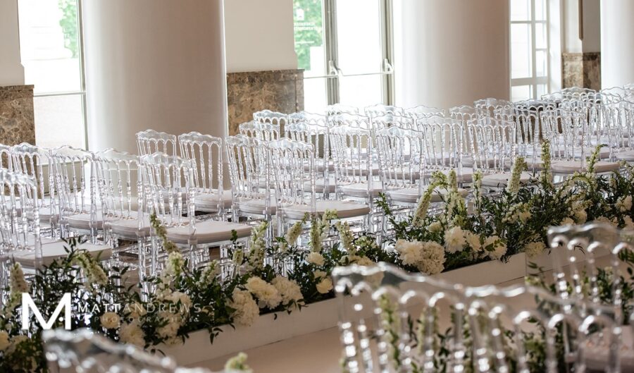 Clear chiavari wedding ceremony chairs: Floral Filled Luxurious Wedding by LMA Designs featured on Nashville Bride Guide