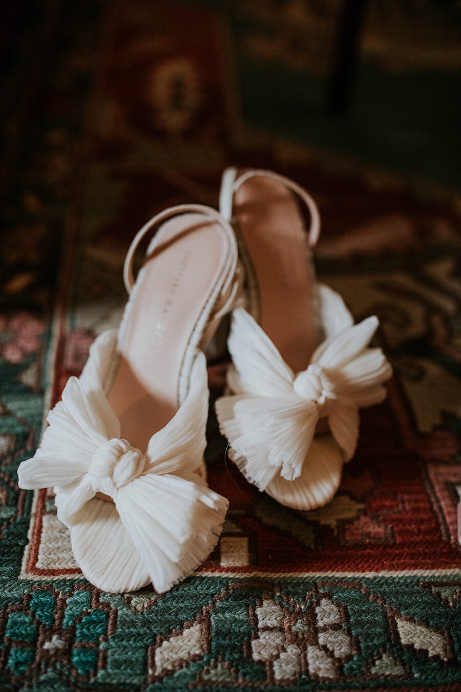White bow-tie bridal shoes: Timeless Loveless Barn Winter Wedding by Kendall Parsons featured on Nashville Bride Guide