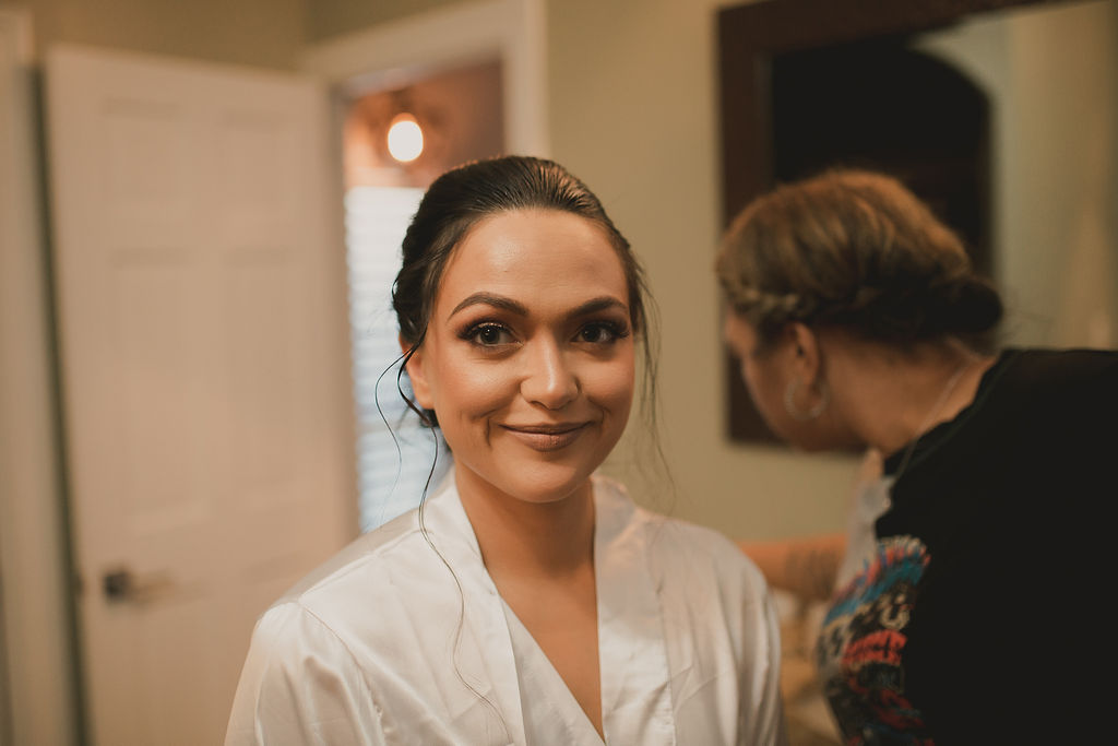 Bride getting ready for wedding at Reunion Stay