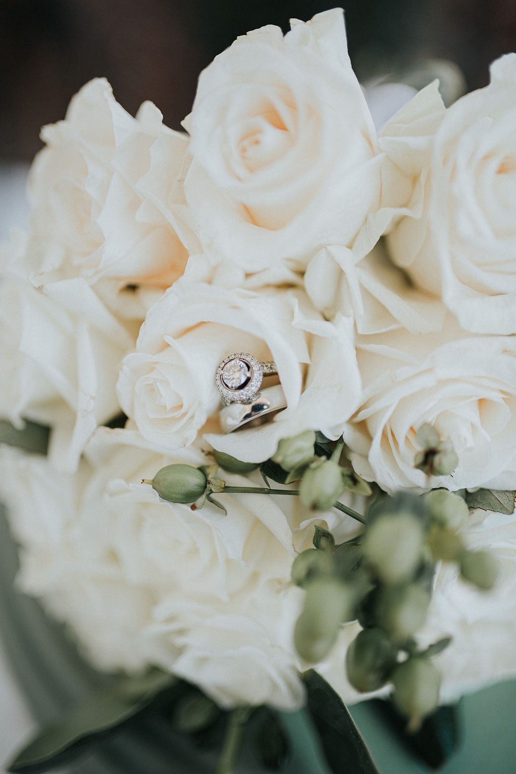 Wedding ring sitting in white wedding bouquet: Romantic Outdoor Wedding at Reunion Stay