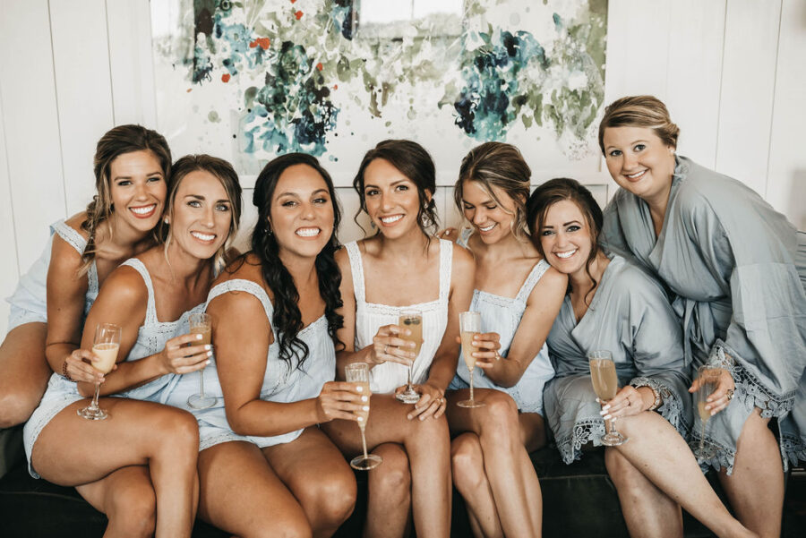 bridal party portrait with champagne