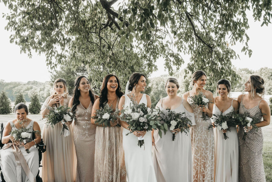 bridal party portrait in mismatched neutral bridesmaid dresses