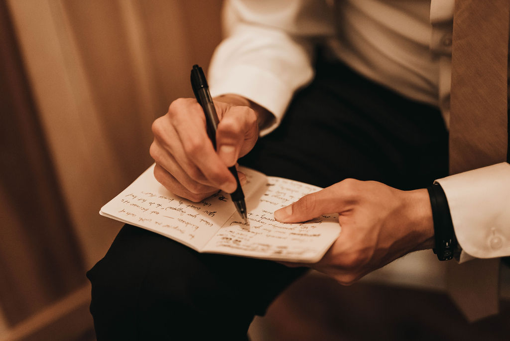 Groom writing a letter to his bride