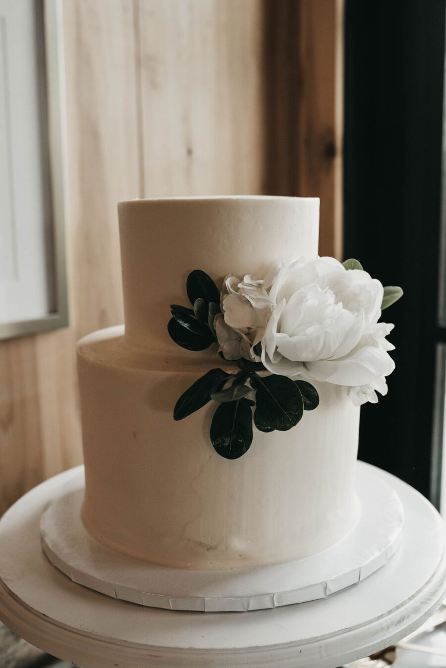 simple wedding cake design with greenery
