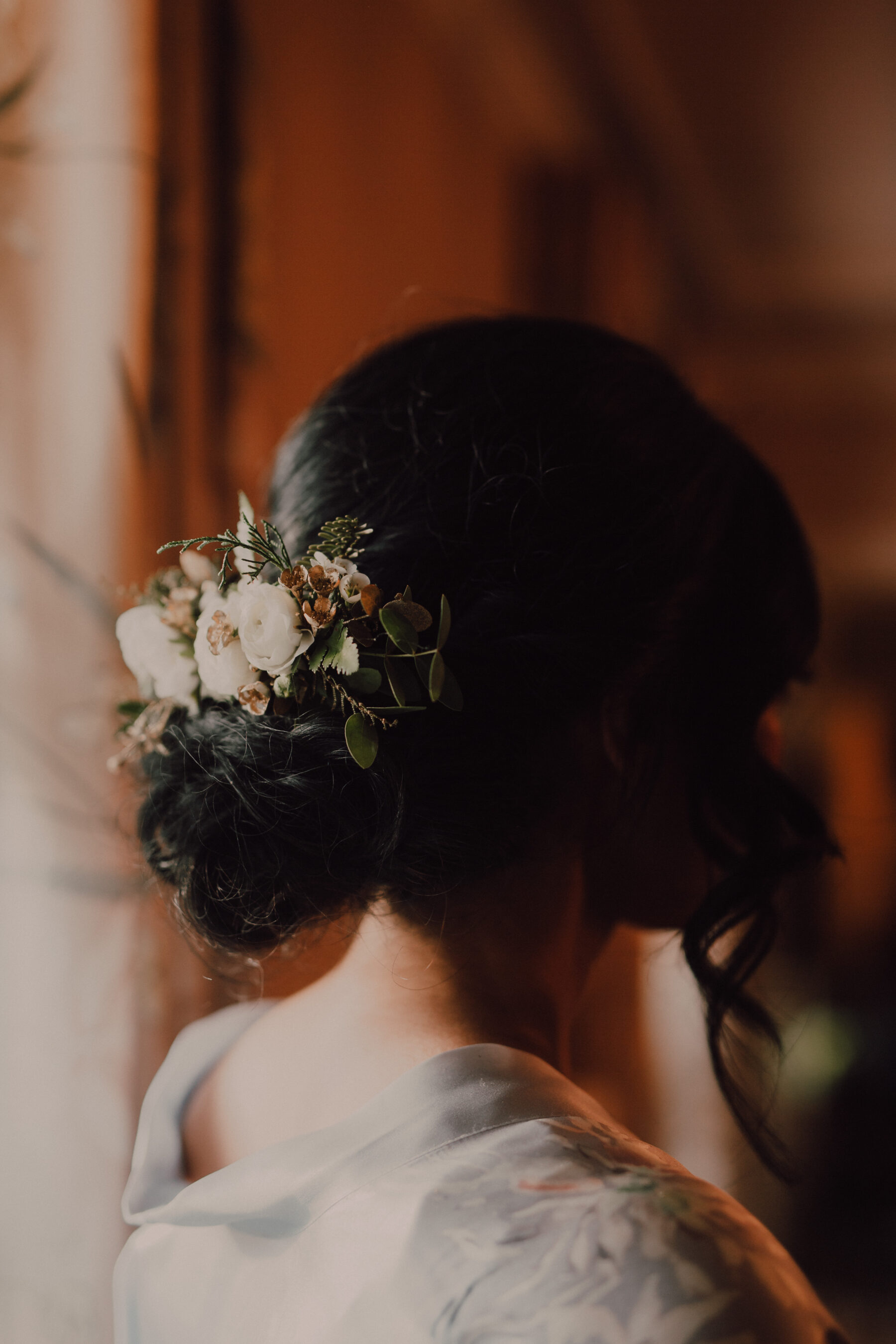 Bridal updo with flower hair piece | Nashville Bride Guide