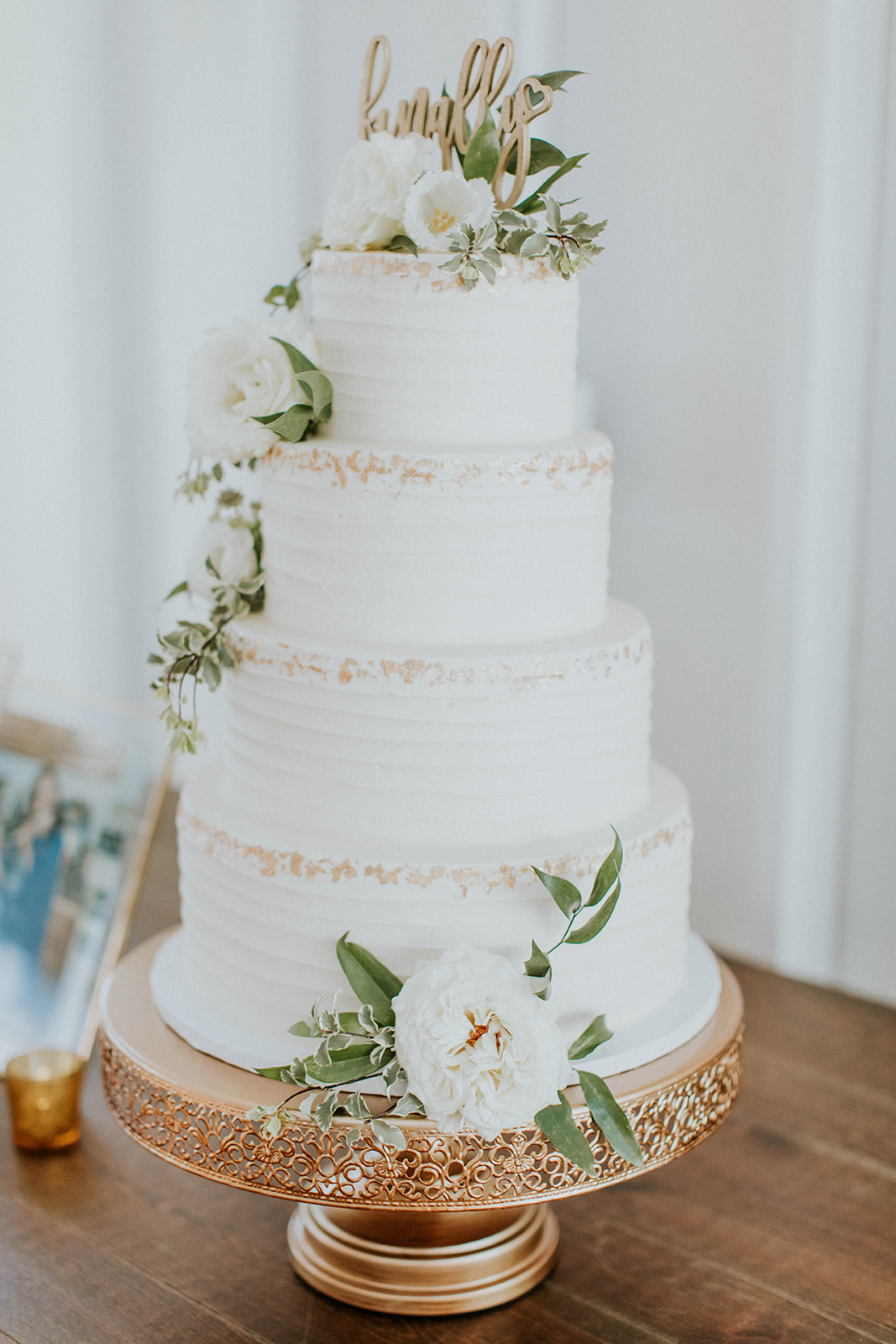 White wedding cake with ivory flowers | Nashville Bride Guide