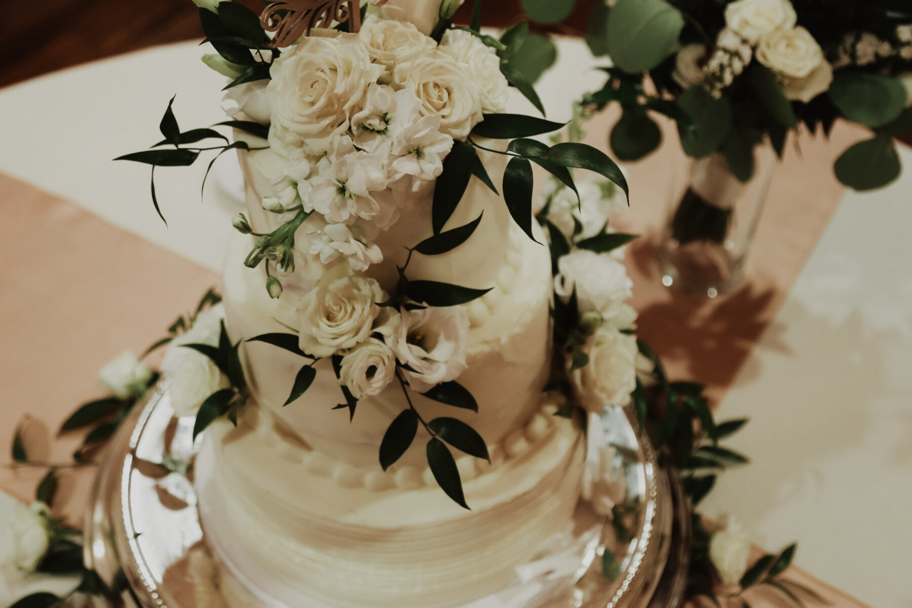 White wedding cake with greenery | Nashville Bride Guide