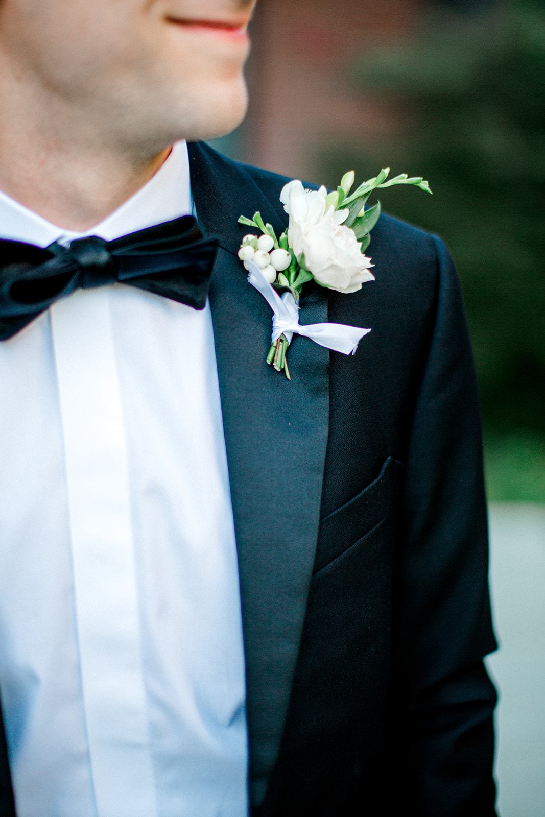 White and greenery wedding boutonniere