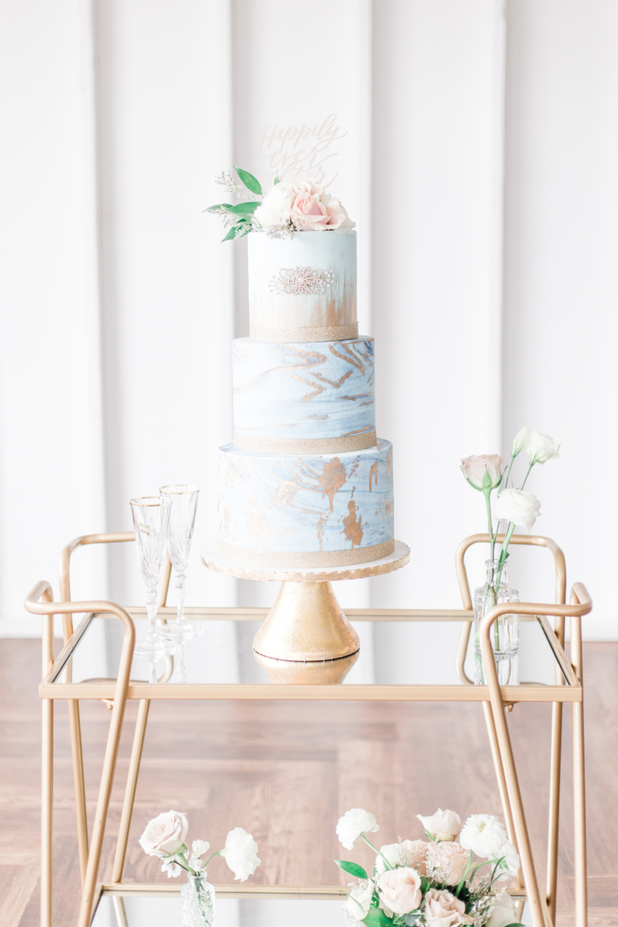 Blue and gold fine art wedding cake