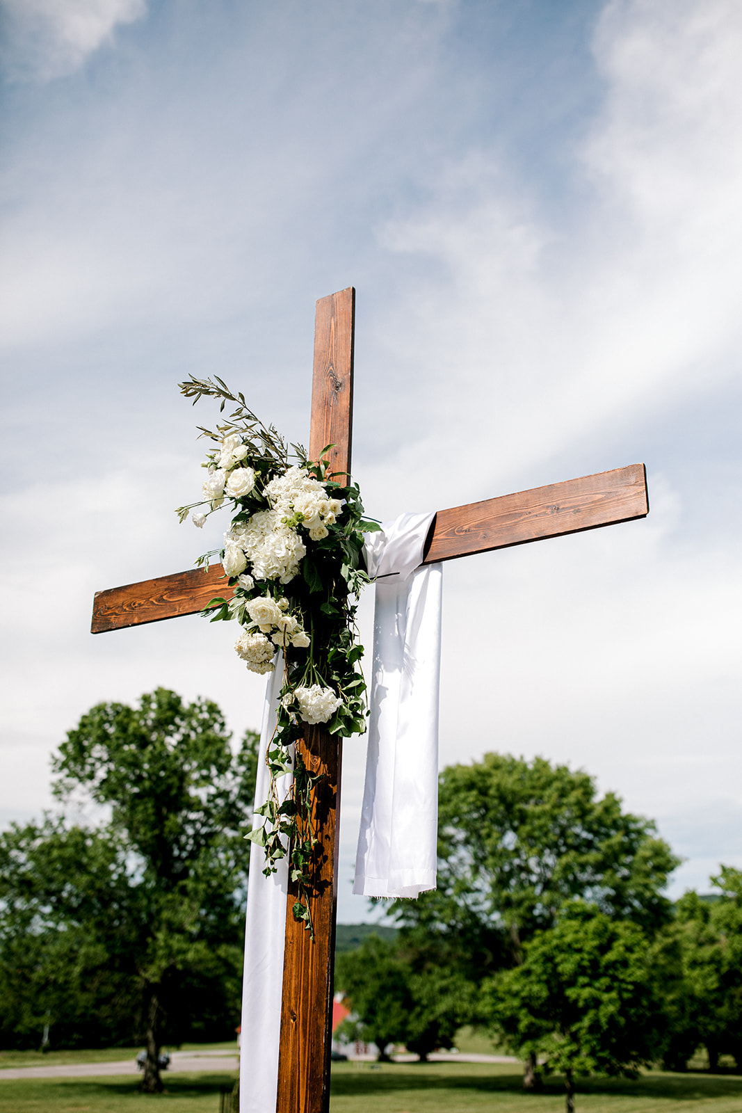 Outdoor wedding ceremony wooden cross