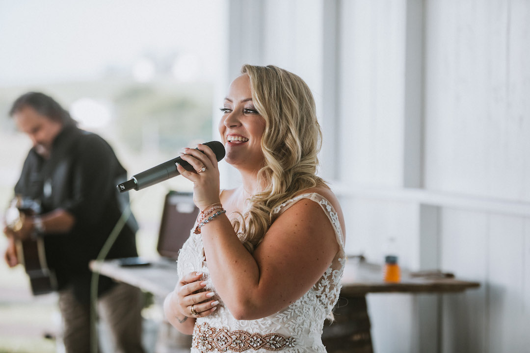 Bride performing song for groom
