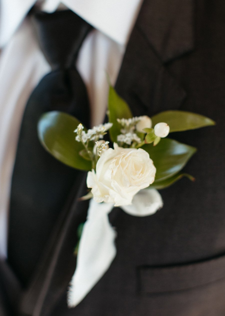 White flower and greenery wedding boutonniere