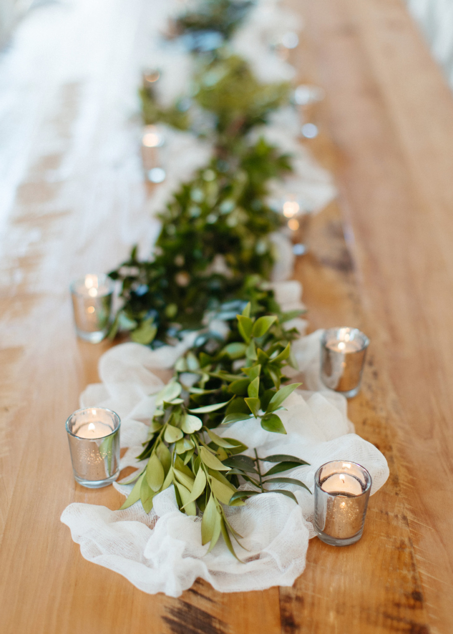 Greenery and candles wedding centerpieces