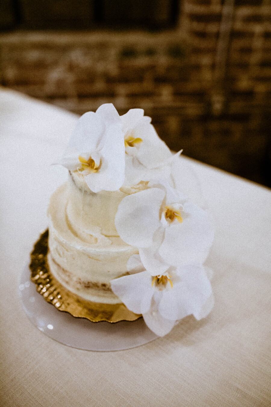 Small wedding cake with white orchids