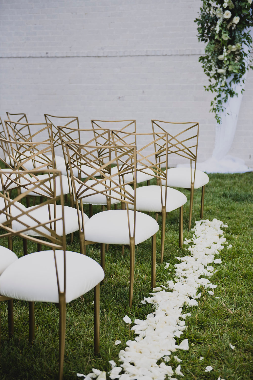 outdoor wedding ceremony with gold chameleon chair