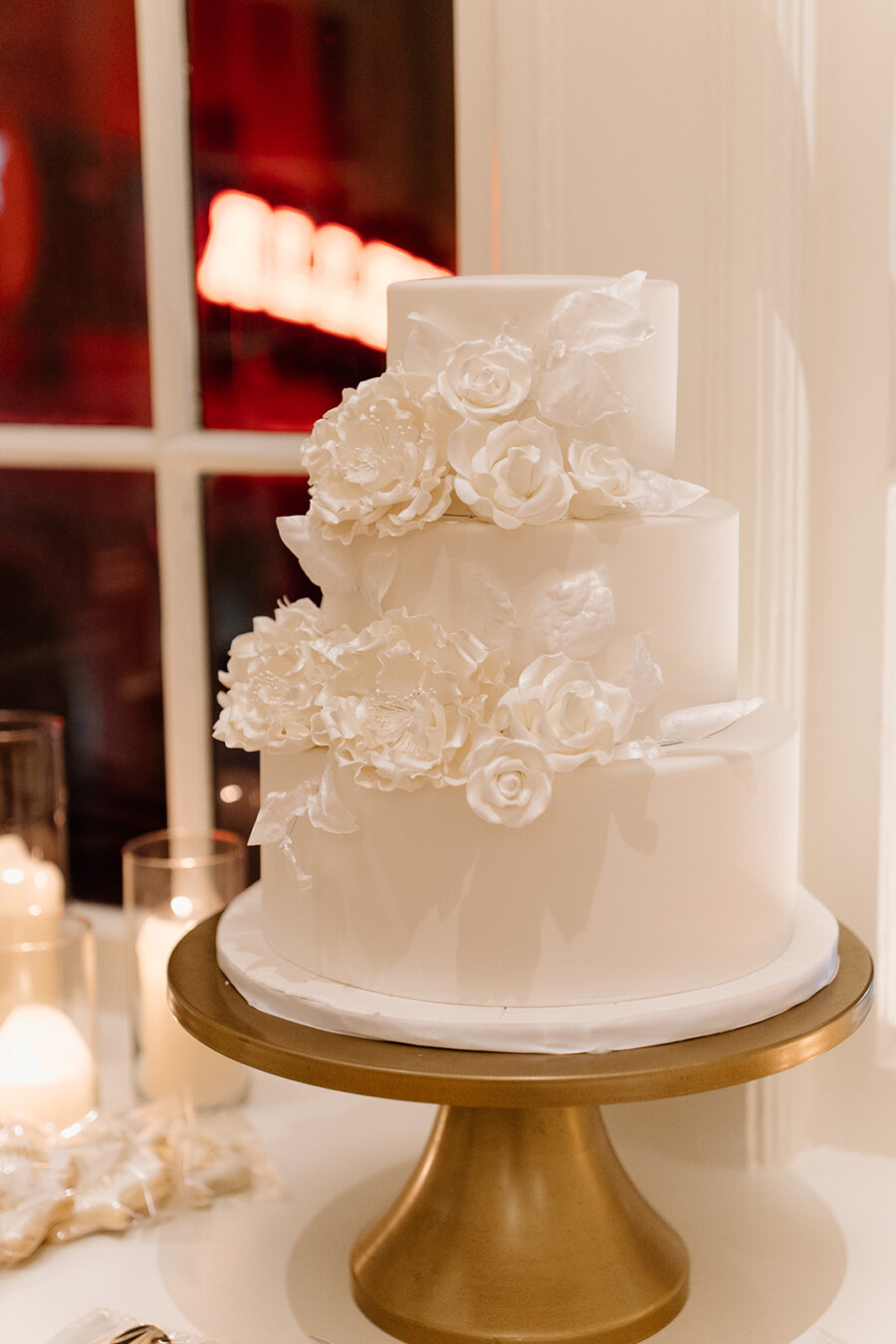 White wedding cake with white sugar flowers