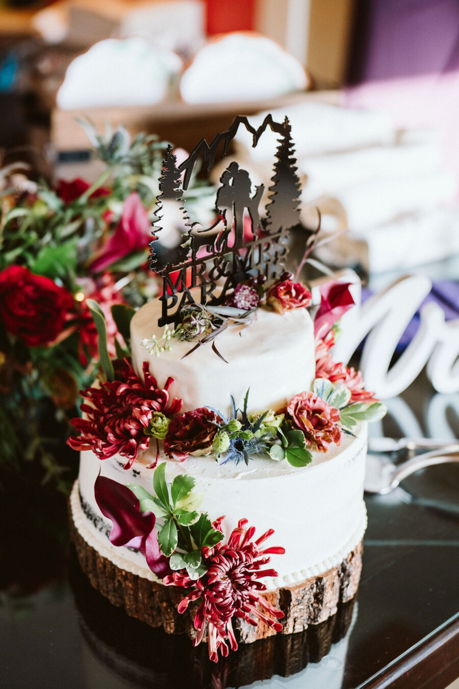White wedding cake with bright flowers