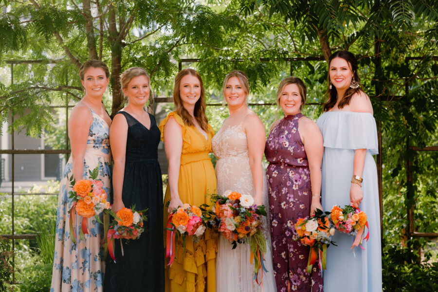 Whimsical mismatched bridesmaids dresses