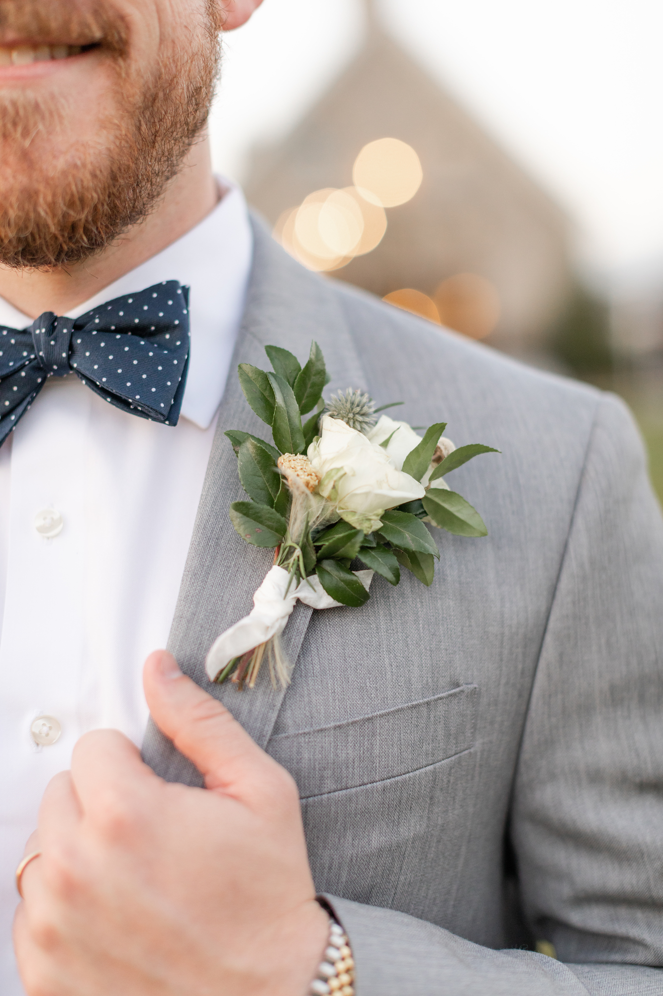 Gray wedding suit with polka dot bow tie