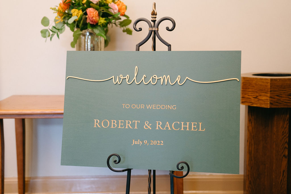 Green and gold wedding sign
