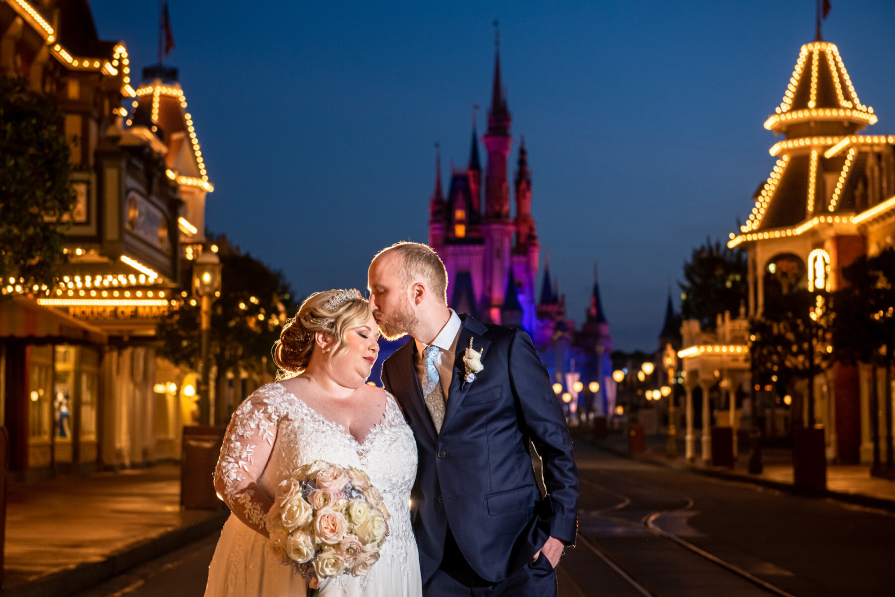 Newlyweds in front of Disney Castle