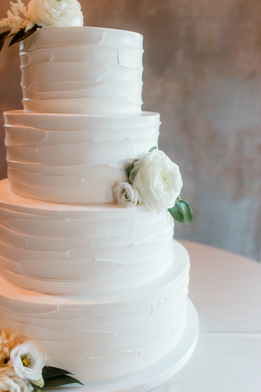 All White Wedding Cake with Flowers