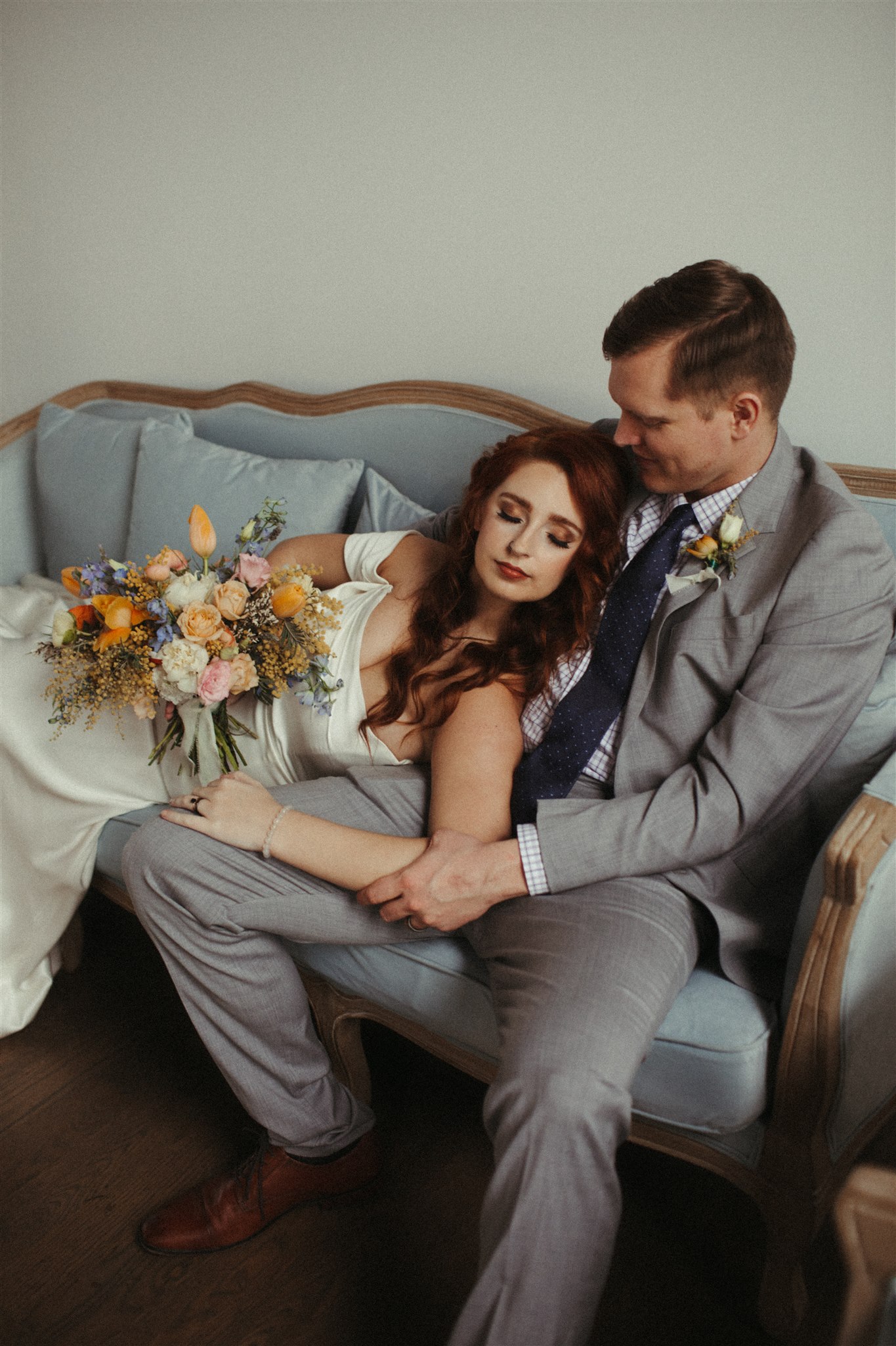 Couple on Couch with Bouquet