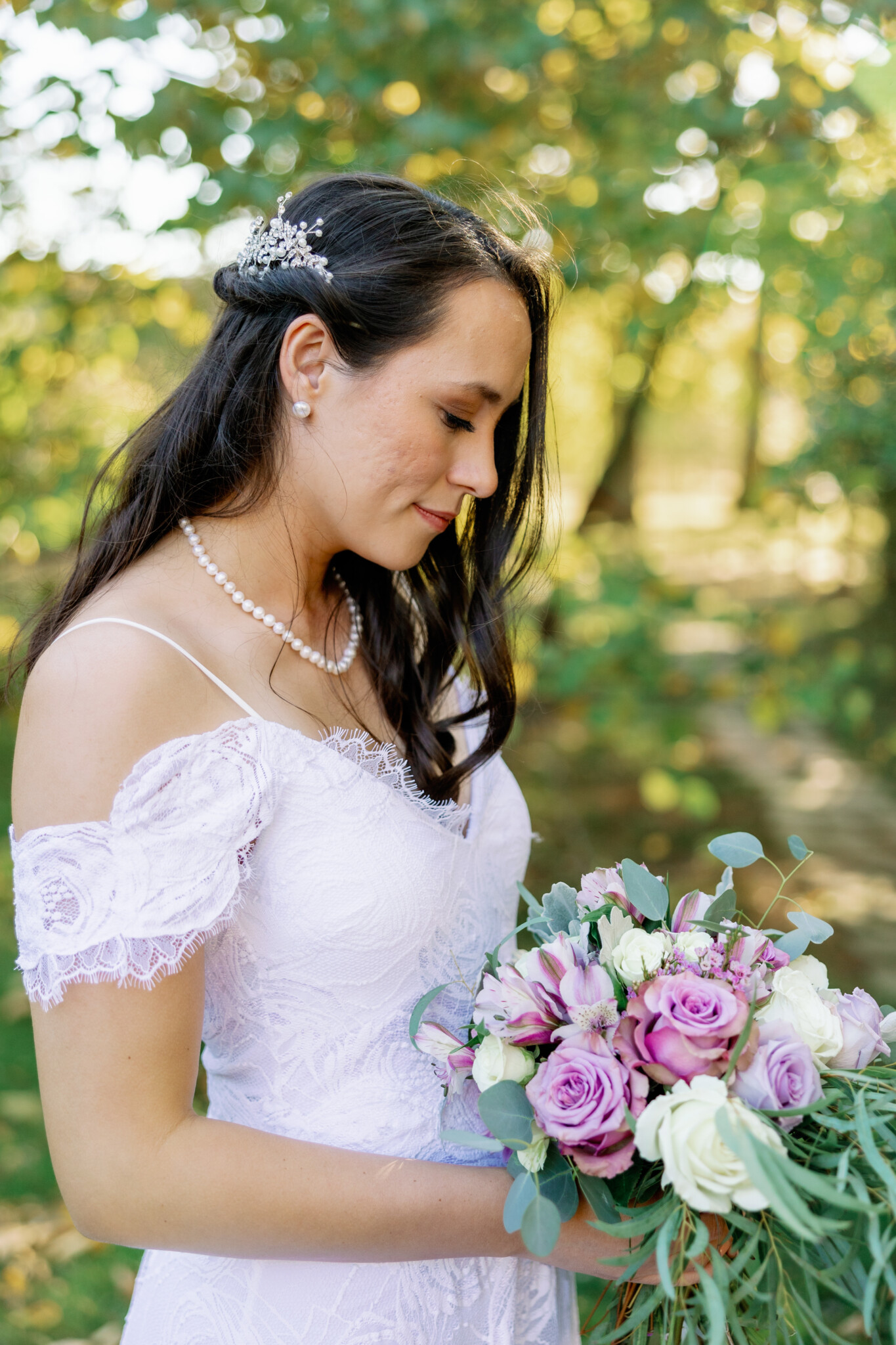 Bride looking at florals